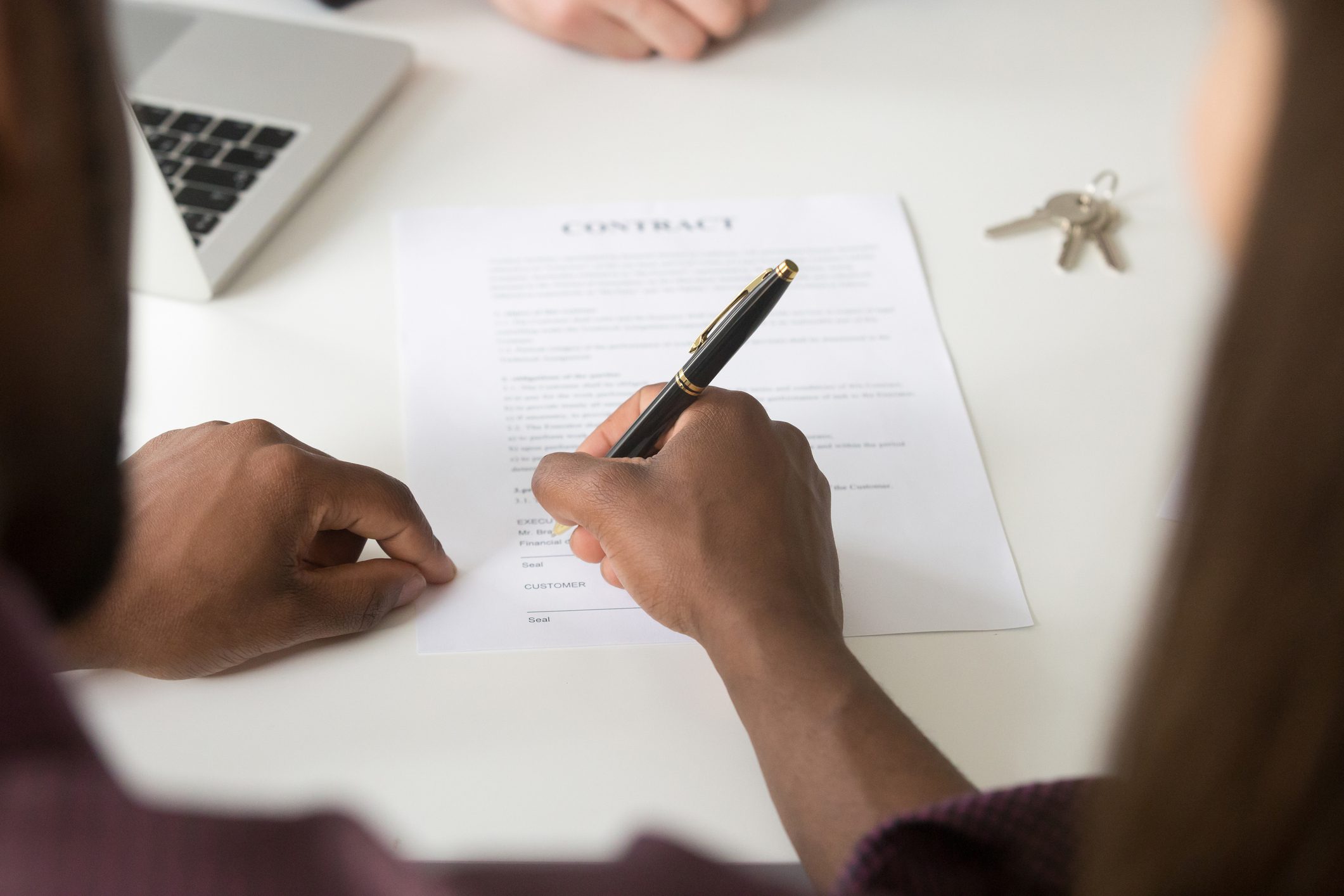Signing a contract with a pen