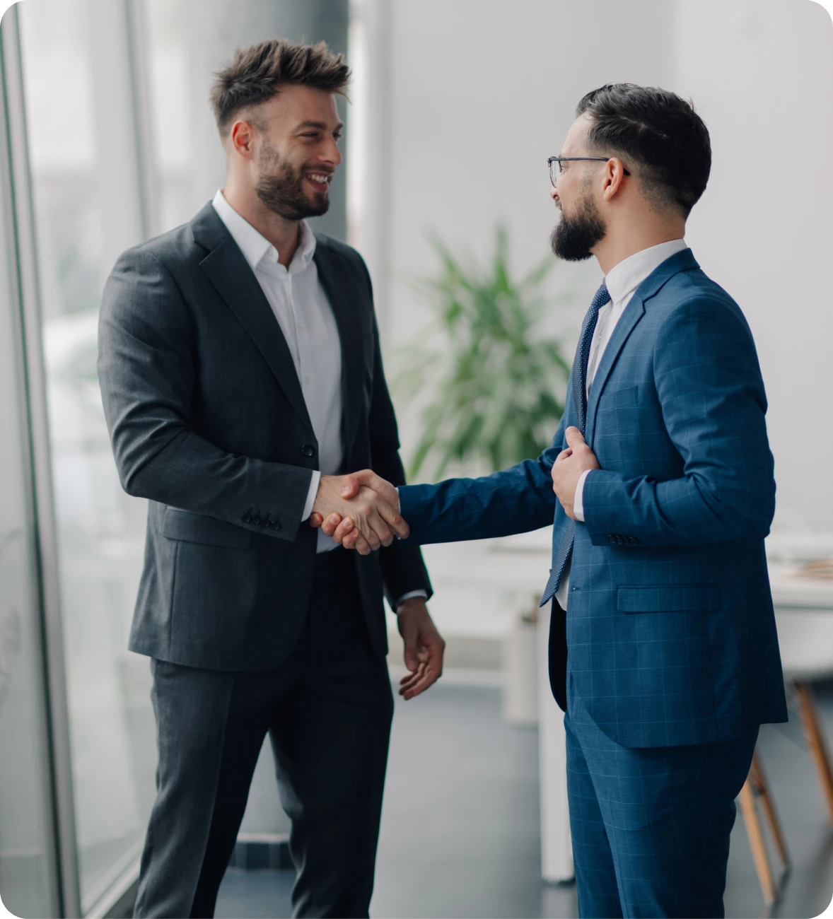 Professional handshake in modern workspace