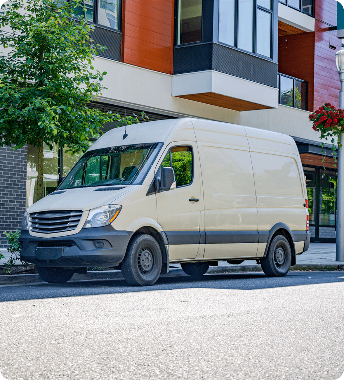 White delivery van parked on street