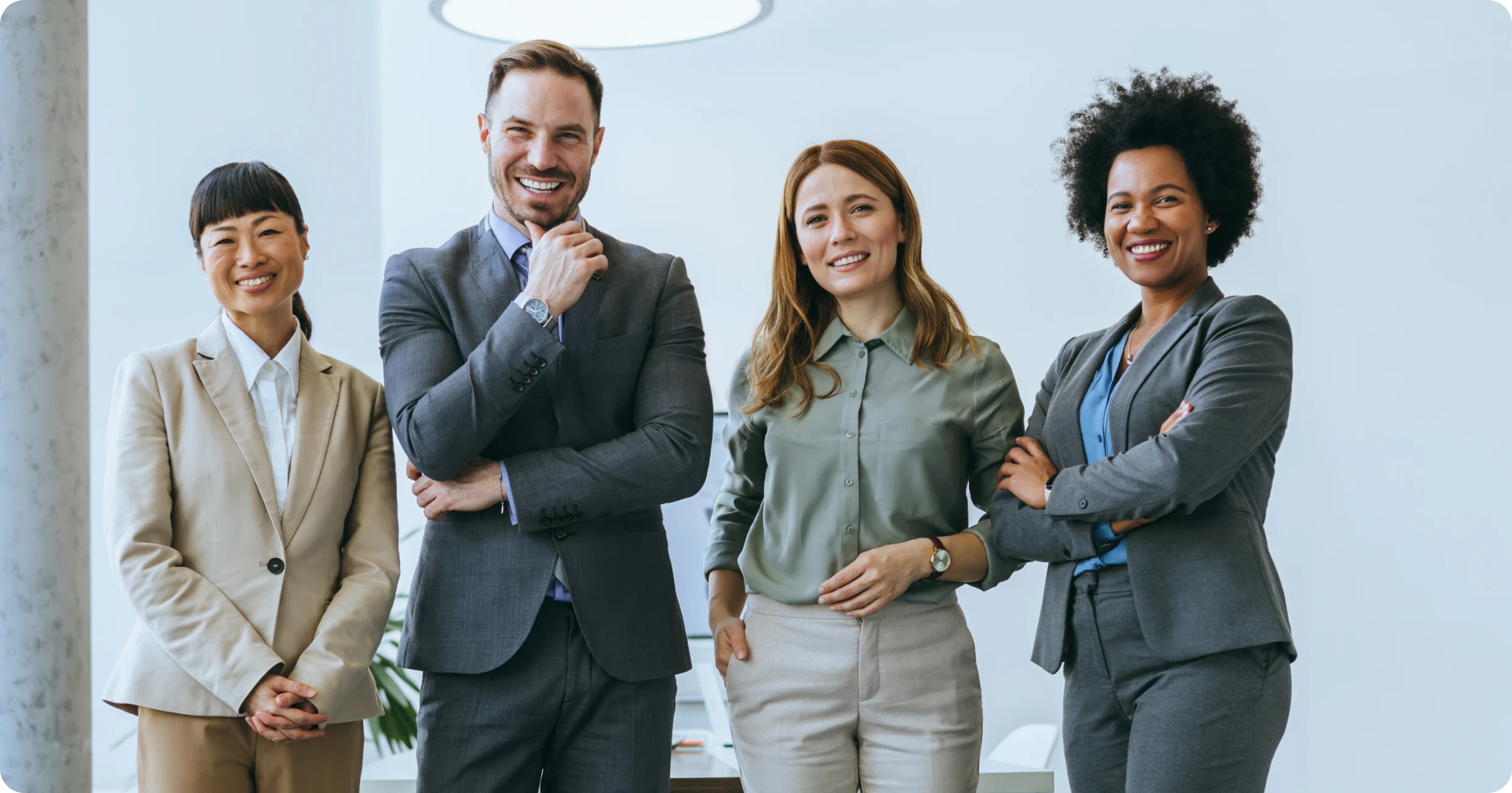 Diverse professionals standing together confidently