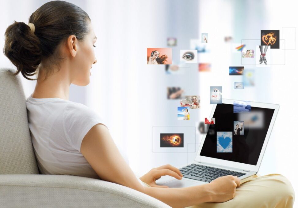Girl working on computer in light room