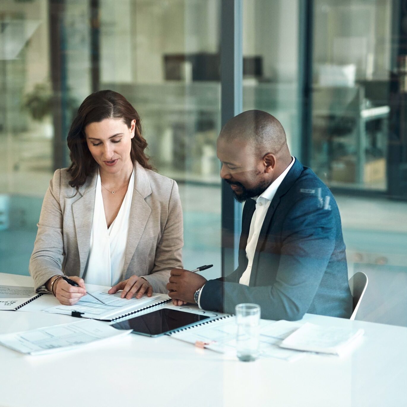 Coworkers reviewing paperwork together