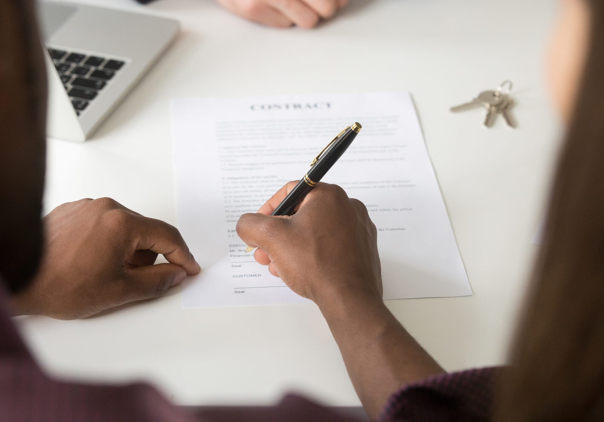 Signing a contract with a pen