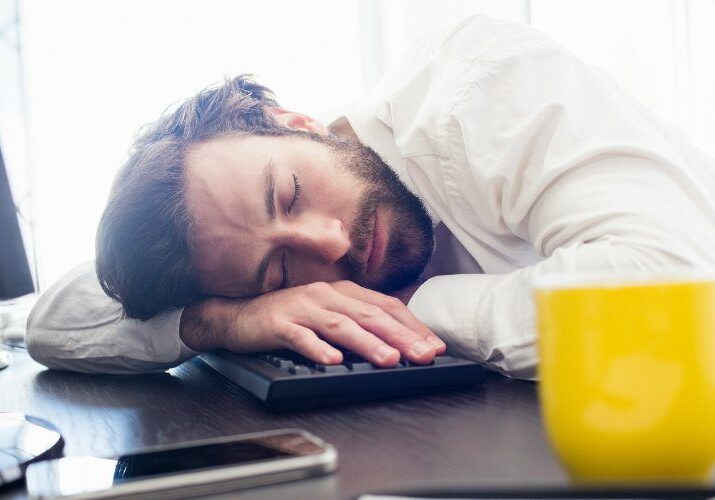 bigstock-A-man-sleeping-on-his-desk-in-135676718-1